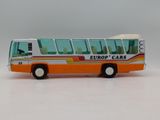 a toy bus that is sitting on a white surface
