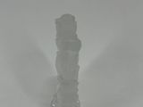 a glass vase that is sitting in the snow