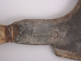 an old axe with a wooden handle on a white surface