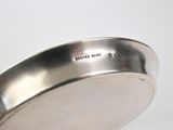 a close up of a metal pan with a handle