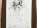 painting of two nudes in a gold frame on a white wall