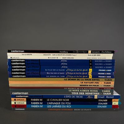 several books are stacked on top of each other on a table