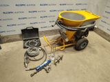 the concrete mixer is sitting on the floor next to the tools