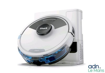 a robot vacuum that is sitting on top of a table