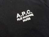 the logo on the back of a black jacket with white letters