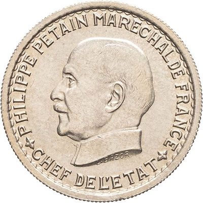 Gros plan sur une pièce de monnaie portant le visage d'un homme