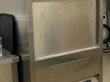 a stainless steel refrigerator in the middle of a kitchen