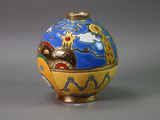 a blue and yellow vase with a picture of a boat on it