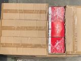 a box with a bunch of red bags on top of it