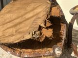 a piece of fabric that has been torn off of the back of a chair