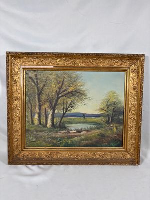 tableau représentant un paysage avec des arbres et une rivière, dans un cadre doré