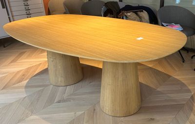 a large wooden table in the middle of a room