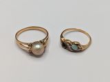 two gold rings with oplites and diamonds