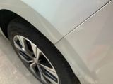 a close up of a car ' s tire on the ground