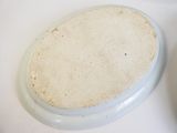 a white plate with a brown substance on top of it