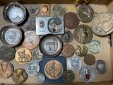 a box full of coins that are sitting on a table