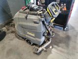 a machine that is sitting on the floor in the garage