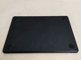 the back of a black laptop computer sitting on top of a white surface