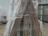 a large pile of windows sitting on a pallet