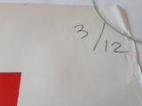 someone is writing on a piece of paper with a magnifying glass