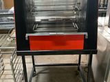 a red oven that is sitting in the middle of a kitchen
