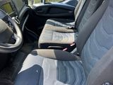a view of the inside of a van with the driver ' s seat up