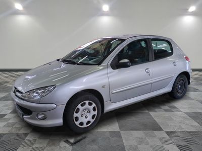 a picture of a silver car parked in a garage