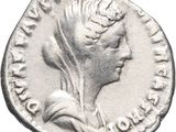 a close up of a coin with a woman ' s head on it