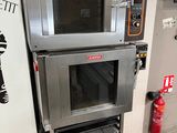 two ovens stacked on top of each other in a kitchen
