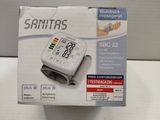 a white box with a blood pressure monitor on it