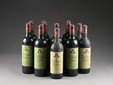 six bottles of wine are lined up in a row