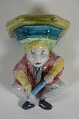 BAVENT Corbeau en faïence émaillée représentant un lutin bar…