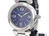 a watch with a blue face on a black stand