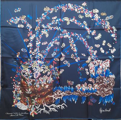 an image of a blue silk scarf with a picture of a tree and flowers