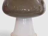 a brown mushroom shaped object on a white base