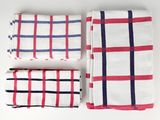 a set of three red, white and blue plaid napkins