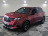 the red suv is parked in a large room with a checkered floor