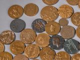 a lot of coins that are on the table