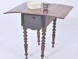 a small table with a cup on top of it
