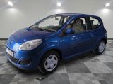 a picture of a small blue car parked in a garage