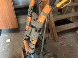 a hand truck that has a bunch of tools in it