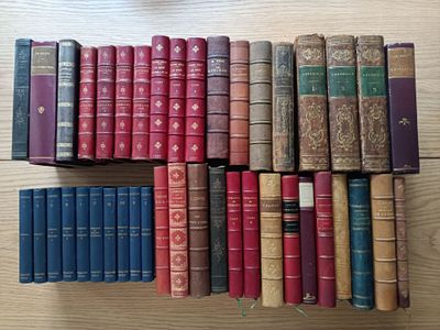 a lot of old books on the table together
