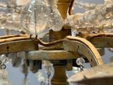 a close up of a chandelier with glass beads hanging from it