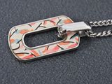 a close up of a necklace on a black surface