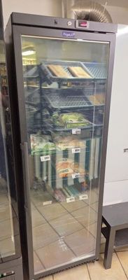 a refrigerator that has a lot of food inside of it