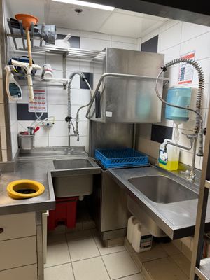 a kitchen with a sink and a stove in it
