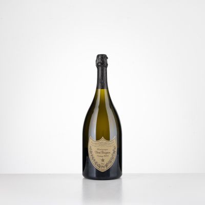 a bottle of champagne sitting on top of a table