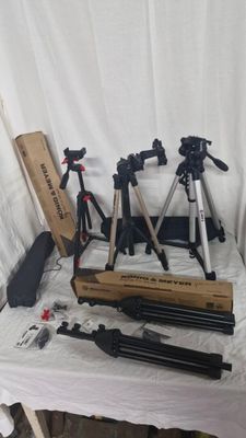 many different types of tripods on a table