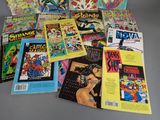a lot of comic books that are on the table