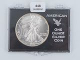 an image of a silver coin in a plastic case